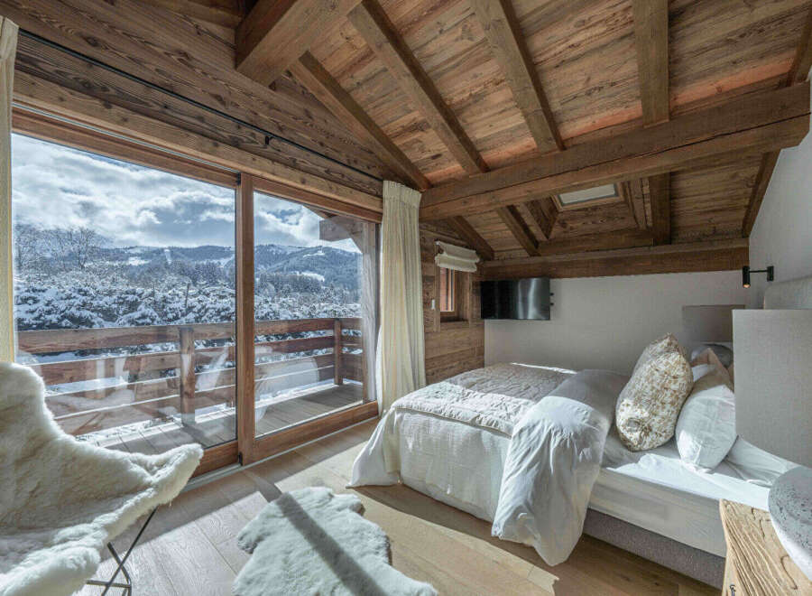 Experience the ultimate in luxury and tranquility with this stunning chalet bedroom.