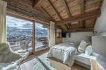 Experience the ultimate in luxury and tranquility with this stunning chalet bedroom.