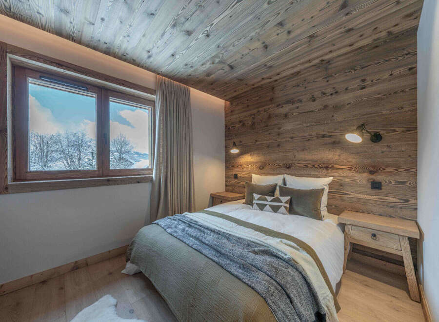 Experience the epitome of rustic elegance in this stunning bedroom.