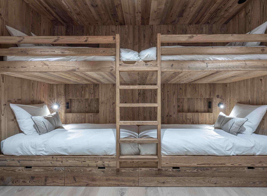 This stunning property features custom-built bunk beds, perfect for a vacation home or a kid's room.