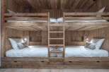 This stunning property features custom-built bunk beds, perfect for a vacation home or a kid's room.