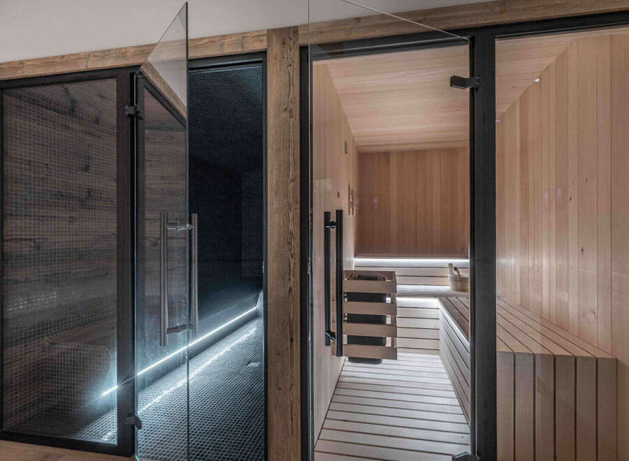 Step into luxury with this stunning sauna and spa area.