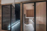 Step into luxury with this stunning sauna and spa area.