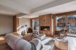 Experience luxury living in this stunning property featuring a cozy fireplace and expansive windows.