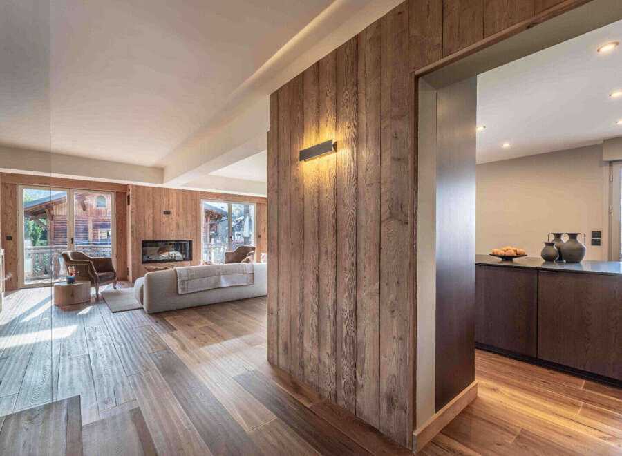 This stunning property boasts a warm and inviting interior with beautiful wooden accents throughout.
