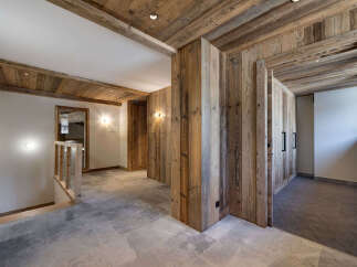 Experience rustic charm and modern elegance in this stunning property featuring exposed wooden beams and walls that exude warmth and character.