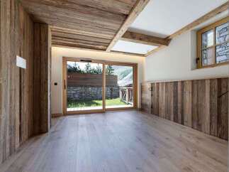 Experience rustic charm and modern comfort in this beautifully appointed room featuring natural wood finishes throughout.
