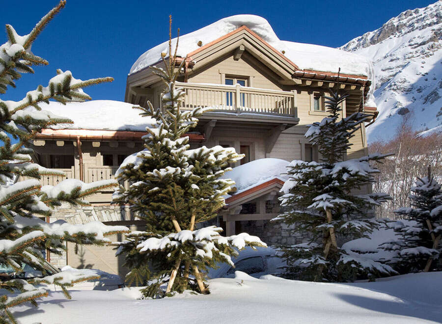 Nestled in a winter wonderland, this stunning property boasts a charming chalet-style design.