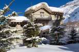 Nestled in a winter wonderland, this stunning property boasts a charming chalet-style design.