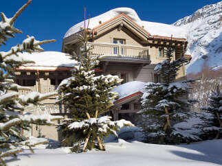 Nestled in a winter wonderland, this stunning property boasts a charming chalet-style design.
