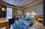 Experience rustic luxury in this stunning bedroom.