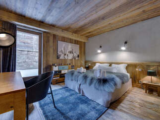 Experience rustic luxury in this stunning bedroom.