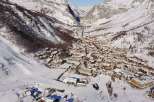 Discover the charm of this stunning mountain village nestled in a snowy valley.