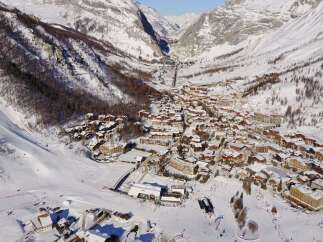 Discover the charm of this stunning mountain village nestled in a snowy valley.