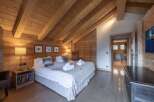 Experience the warmth and charm of this stunning bedroom, featuring exquisite wooden accents throughout.
