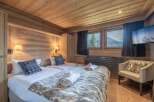 Experience the ultimate in alpine luxury with this stunning bedroom.