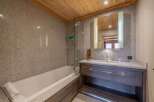 Step into luxury with this stunning bathroom featuring a sleek design and high-end finishes.