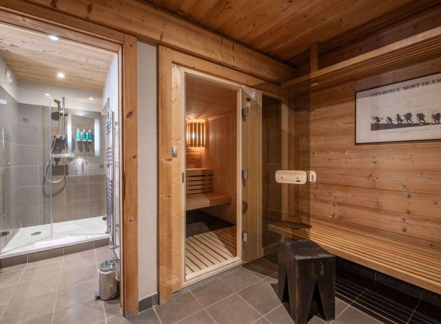 Experience ultimate relaxation in this luxurious property featuring a private sauna and a modern shower.