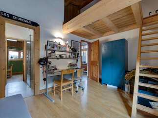 Discover this charming property featuring a unique loft space and a cozy study area.