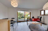 This bright and airy living space features a modern design with ample natural light.