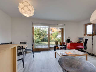 This bright and airy living space features a modern design with ample natural light.