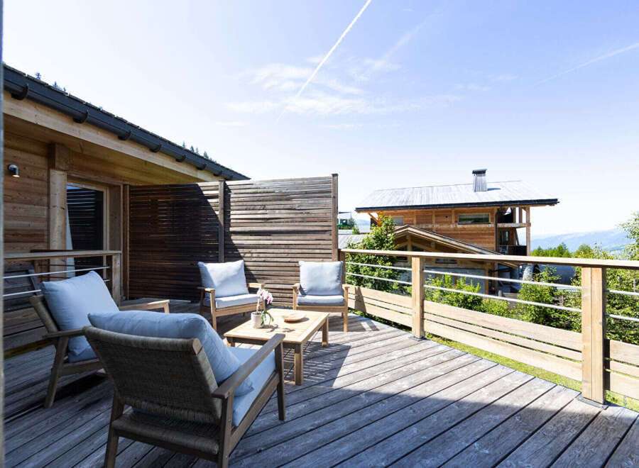 Enjoy breathtaking mountain views from this charming wooden deck, perfect for relaxing or entertaining.