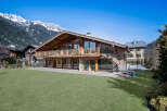 This stunning chalet-style home offers a luxurious mountain living experience.