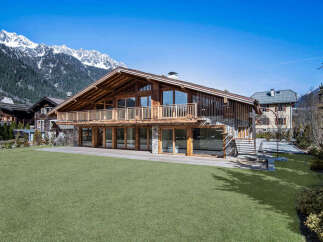 This stunning chalet-style home offers a luxurious mountain living experience.