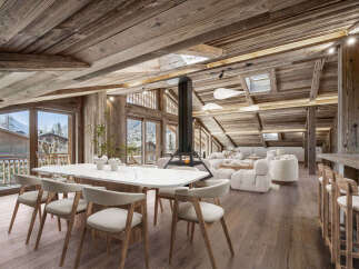 Experience luxury living in this stunning chalet, featuring a spacious open-plan design.
