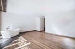This stunning bathroom features a modern, minimalist design with a sleek, freestanding bathtub.