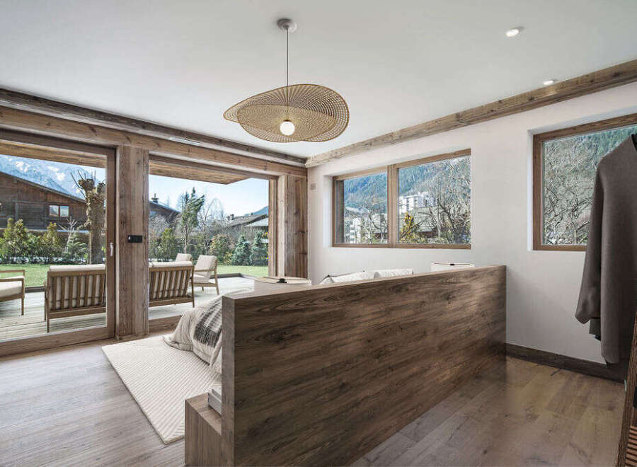 Experience luxury living in this stunning property, featuring expansive windows that frame breathtaking mountain views.