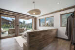 Experience luxury living in this stunning property, featuring expansive windows that frame breathtaking mountain views.