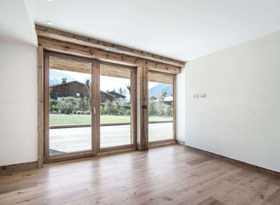 Experience the charm of this stunning property, featuring expansive windows that flood the interior with natural light.