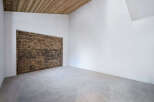 Discover the charm of this unique property featuring a stunning wooden door and a modern, minimalist design.