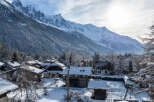 Nestled in a picturesque winter wonderland, this charming property offers stunning views of snow-capped mountains.
