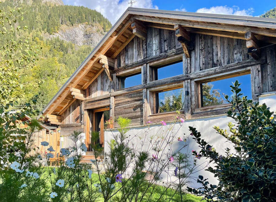 This stunning wooden chalet offers a perfect blend of rustic charm and modern comfort.