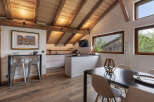 Experience rustic charm and modern convenience in this stunning mountain chalet kitchen and dining area.