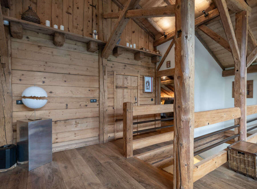 Experience rustic charm in this beautifully appointed wooden interior, featuring exposed beams and natural wood finishes throughout.