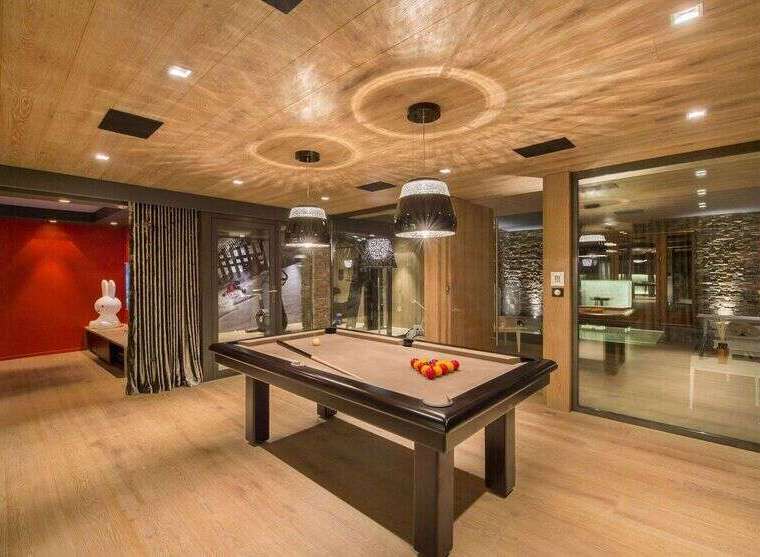 Step into luxury with this stunning property featuring a dedicated game room.