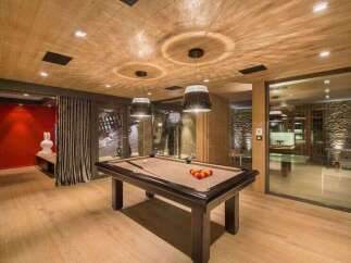Step into luxury with this stunning property featuring a dedicated game room.