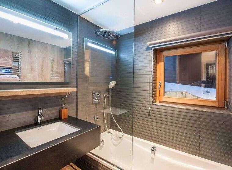 This modern bathroom features a sleek design with a combination of functionality and style.