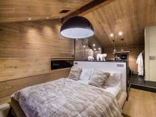 Experience luxury in this stunning bedroom featuring a unique design.