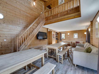This stunning wooden cabin boasts a warm and inviting interior, perfect for a cozy retreat.