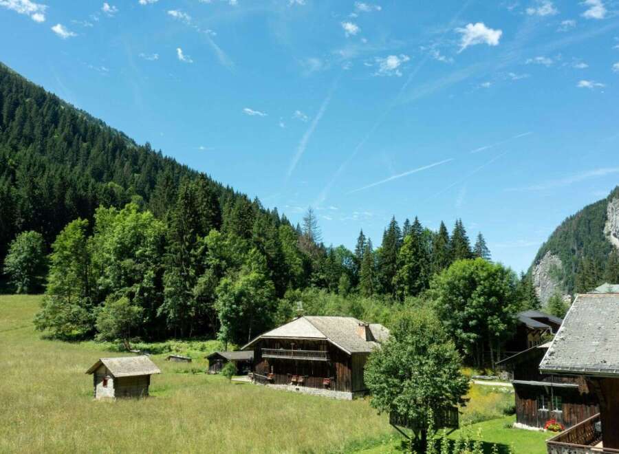 Nestled in a serene mountain landscape, this charming property offers a perfect blend of rustic charm and natural beauty.