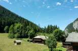 Nestled in a serene mountain landscape, this charming property offers a perfect blend of rustic charm and natural beauty.