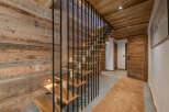 This stunning property boasts a beautifully crafted wooden staircase, creating a warm and inviting atmosphere.