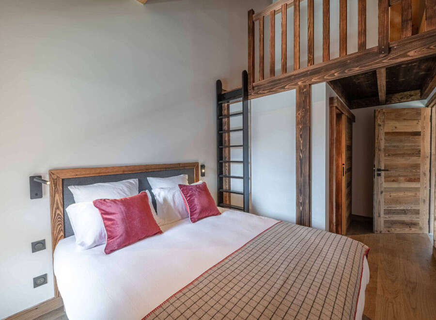 Discover the charm of this cozy bedroom featuring a unique loft space, perfect for a guest or extra storage.