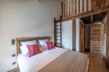 Discover the charm of this cozy bedroom featuring a unique loft space, perfect for a guest or extra storage.