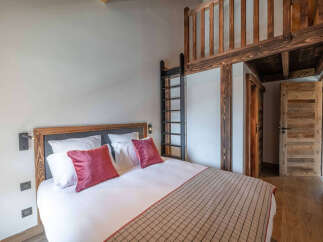 Discover the charm of this cozy bedroom featuring a unique loft space, perfect for a guest or extra storage.
