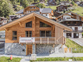 Discover the charm of this stunning 6-bedroom chalet, perfectly nestled in a picturesque mountain setting.